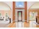 Grand foyer with high ceilings, hardwood floors, and a view of arched doorways at 1603 Drowning Creek Rd, Dacula, GA 30019