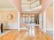 Grand foyer with hardwood floors, staircase, and views into multiple living spaces, creating a welcoming entrance at 1603 Drowning Creek Rd, Dacula, GA 30019