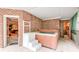Hot tub area featuring tiled floors and access to a sauna for relaxation at 1603 Drowning Creek Rd, Dacula, GA 30019