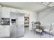 Eat-in kitchenette featuring stainless steel appliances and a view to the hall at 1603 Drowning Creek Rd, Dacula, GA 30019