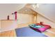 Large living area featuring hardwood floors, a bed, and a partial kitchen with white cabinets and breakfast bar at 1603 Drowning Creek Rd, Dacula, GA 30019
