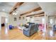 Spacious living area featuring wood beams and hardwood floors and abundant seating at 1603 Drowning Creek Rd, Dacula, GA 30019