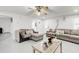 Bright living room with neutral-toned sofas, a wooden coffee table, and lots of natural light at 1603 Drowning Creek Rd, Dacula, GA 30019