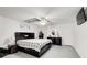 Spacious main bedroom with a large bed, modern ceiling fan, and a sleek, contemporary design at 1603 Drowning Creek Rd, Dacula, GA 30019