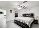 Bright main bedroom with a ceiling fan, dark furniture, and an open closet at 1603 Drowning Creek Rd, Dacula, GA 30019