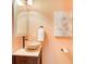 Stylish powder room with a vessel sink, custom vanity, and elegant fixtures for a touch of sophistication at 1603 Drowning Creek Rd, Dacula, GA 30019