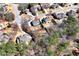 Aerial view displays the home surrounded by mature trees and lush landscaping at 2196 Abbott Dr, Buford, GA 30519