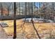 Spacious backyard features a garden area, a stone terrace, and privacy fencing at 2196 Abbott Dr, Buford, GA 30519