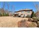 Spacious backyard featuring a covered patio, perfect for outdoor living and entertaining at 2196 Abbott Dr, Buford, GA 30519