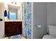 Well lit bathroom with blue and white accents, single sink vanity, and neutral walls at 2196 Abbott Dr, Buford, GA 30519