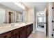 Bathroom featuring a double vanity, large mirror, and tile flooring at 2196 Abbott Dr, Buford, GA 30519