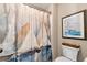 Full bathroom featuring an artistic shower curtain and sailboat wall art at 2196 Abbott Dr, Buford, GA 30519