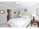 Comfortable bedroom with neutral walls, wall art, carpet, and a plush bed at 2196 Abbott Dr, Buford, GA 30519