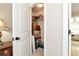 Organized closet with shelves, containing household items and storage boxes in a well-lit space at 2196 Abbott Dr, Buford, GA 30519