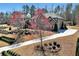 Attractive two-story home featuring mature landscaping, a winding driveway and lush foliage at 2196 Abbott Dr, Buford, GA 30519