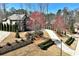 Sprawling two-story home with lush landscaping and a winding driveway, nestled among mature trees at 2196 Abbott Dr, Buford, GA 30519