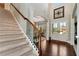 Elegant foyer with hardwood floors, staircase, and high ceilings, offering a grand entrance at 2196 Abbott Dr, Buford, GA 30519