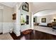 Grand foyer featuring dark wood floors, arched doorways, and views into the formal living room at 2196 Abbott Dr, Buford, GA 30519