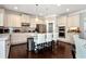 Gourmet kitchen with white cabinets, stainless steel appliances, a center island, and hardwood floors at 2196 Abbott Dr, Buford, GA 30519