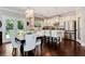 Bright eat-in kitchen features white cabinets, stainless steel appliances, and access to backyard at 2196 Abbott Dr, Buford, GA 30519