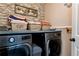 Modern laundry room with front-load washer and dryer, with stylish decor at 2196 Abbott Dr, Buford, GA 30519
