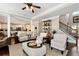 Open-concept living area boasts an adjacent gourmet kitchen and staircase at 2196 Abbott Dr, Buford, GA 30519