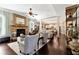 Spacious living room with stone fireplace, hardwood floors, and open access to the kitchen at 2196 Abbott Dr, Buford, GA 30519