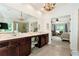 Main bathroom with dual vanity, tile floors, separate shower and view to the main bedroom at 2196 Abbott Dr, Buford, GA 30519