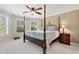 Main bedroom with natural light, ceiling fan, and comfortable furnishings at 2196 Abbott Dr, Buford, GA 30519