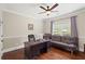 Cozy office space with a ceiling fan, hardwood floors, and a comfortable futon at 2196 Abbott Dr, Buford, GA 30519
