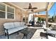 Relaxing covered patio with comfortable seating, ceiling fan, and beautiful outdoor space at 2196 Abbott Dr, Buford, GA 30519