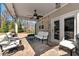 Cozy outdoor patio with a ceiling fan and comfortable seating for relaxation and entertaining at 2196 Abbott Dr, Buford, GA 30519