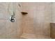 Walk-in shower features tile surround, a built-in seat, and modern fixtures at 2196 Abbott Dr, Buford, GA 30519