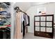 Bright walk-in closet with custom shelving and clothing storage at 2196 Abbott Dr, Buford, GA 30519