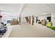 Spacious finished basement featuring carpeted flooring, support beams, recessed lighting, and an adjacent staircase at 4859 Clark Lake Nw Way, Acworth, GA 30102