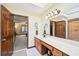 Bright bathroom featuring double sinks, wood cabinets and a walk-in shower at 4859 Clark Lake Nw Way, Acworth, GA 30102