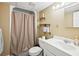 Bathroom featuring a shower/tub, white vanity and shelving for storage at 4859 Clark Lake Nw Way, Acworth, GA 30102