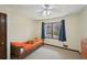 Cozy bedroom featuring natural light from a window, carpet, and a ceiling fan at 4859 Clark Lake Nw Way, Acworth, GA 30102