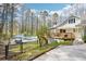 A view of the exterior of this home, highlighting the deck, pool, and surrounding natural beauty at 4859 Clark Lake Nw Way, Acworth, GA 30102