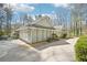 A view of the exterior of this home highlighting the garage and surrounding landscaping at 4859 Clark Lake Nw Way, Acworth, GA 30102