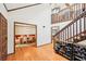 Grand foyer with a staircase, hardwood floors, and a view of the dining room, creating an inviting entrance at 4859 Clark Lake Nw Way, Acworth, GA 30102
