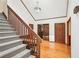 Welcoming foyer features a staircase, hardwood floors, and access to multiple rooms at 4859 Clark Lake Nw Way, Acworth, GA 30102