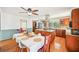 Spacious kitchen featuring an island with granite countertops and an adjacent dining area with natural lighting at 4859 Clark Lake Nw Way, Acworth, GA 30102