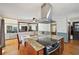 Modern kitchen boasts granite countertops, a sleek range hood, and an adjoining dining area at 4859 Clark Lake Nw Way, Acworth, GA 30102