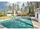 A large pool and patio area with surrounding yard, trees, home, pool house, and seating at 4859 Clark Lake Nw Way, Acworth, GA 30102