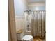 Bathroom featuring shower with curtain and a toilet at 1162 Mason Lee, Loganville, GA 30052