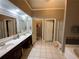 Bathroom with double vanity, updated mirror, and tile floors at 1162 Mason Lee, Loganville, GA 30052