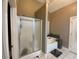 Bathroom featuring a glass-enclosed shower and a separate tub for relaxing soaks at 1162 Mason Lee, Loganville, GA 30052