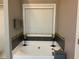 Bathroom with large soaker tub and neutral tile backsplash at 1162 Mason Lee, Loganville, GA 30052