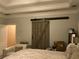 Bedroom showing barn door accenting the neutral paint at 1162 Mason Lee, Loganville, GA 30052